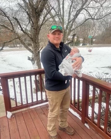 staff sergeant steven smiley holding son